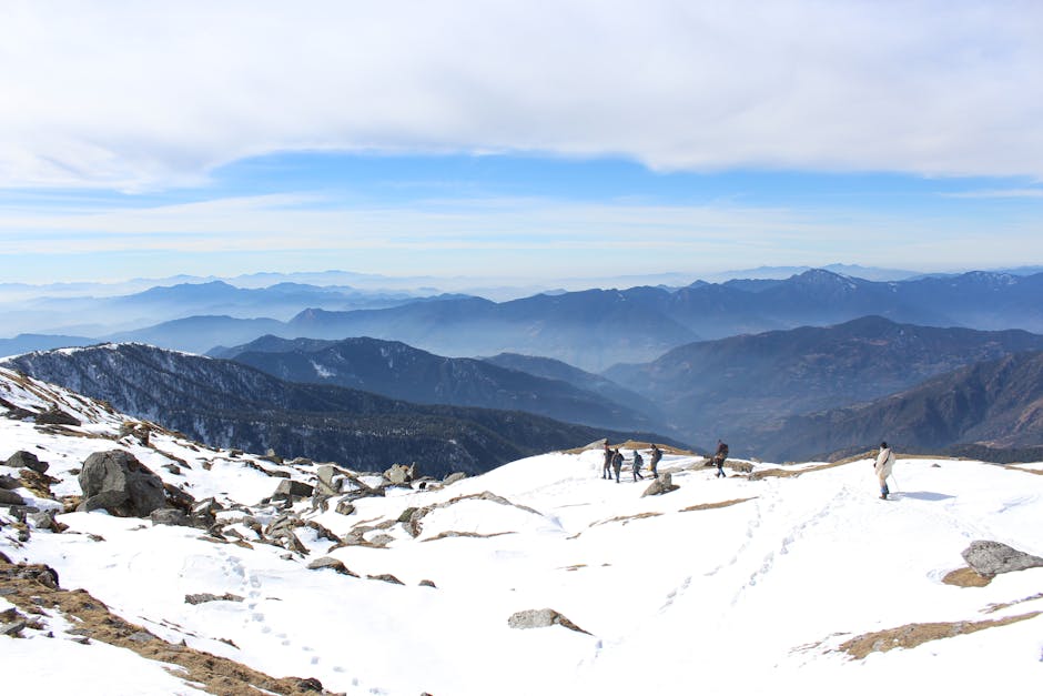 Group of trekkers exploring the snowy Himalayas with scenic mountain views